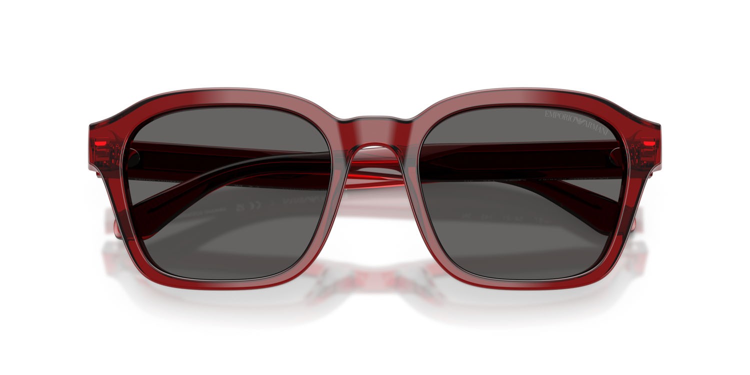 Occhiali da sole Emporio Armani EA 4245U (624887) colore rosso brillante trasparente forma irregolare lenti grigio
