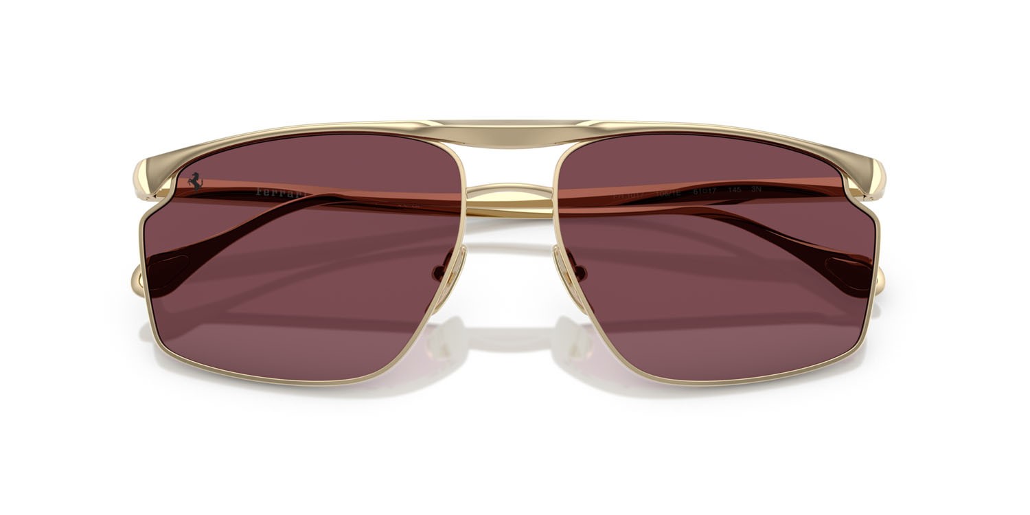 Occhiali da sole Ferrari FH 1017 (106/1E) colore oro pallido forma irregolare lenti bordeaux