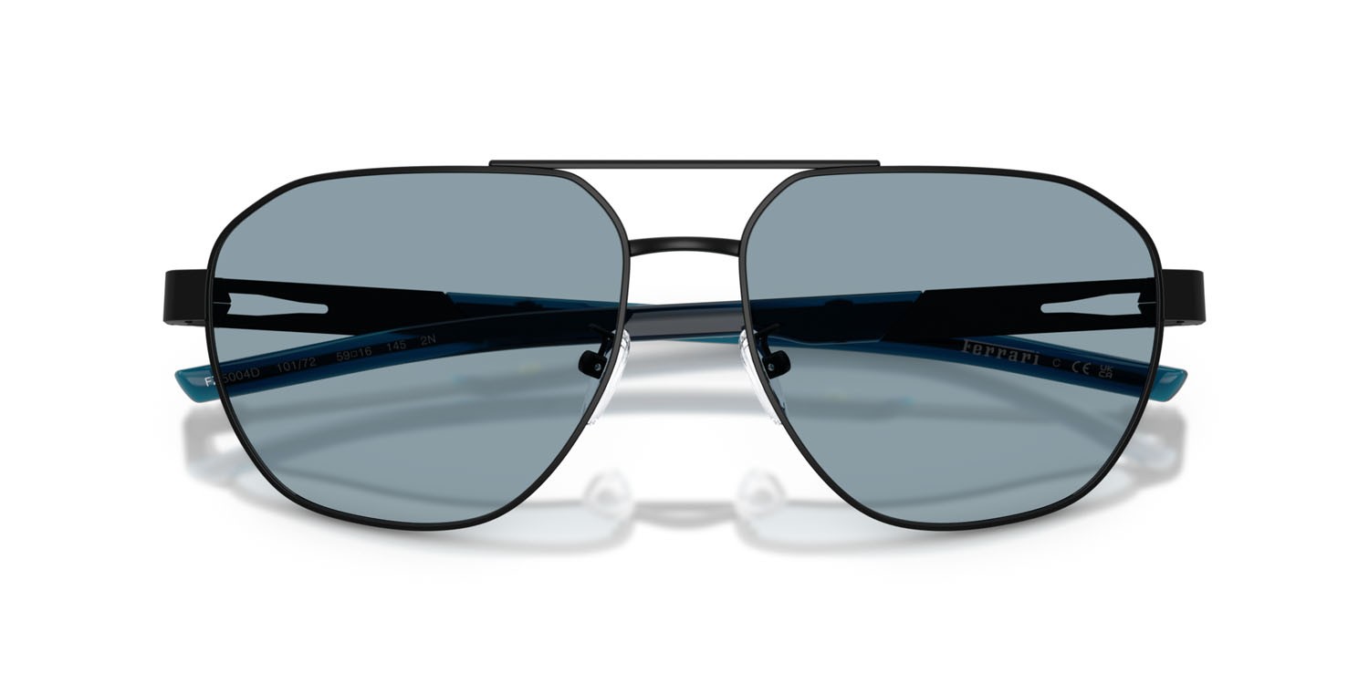 Occhiali da sole Ferrari Scuderia FZ 5004D (101/72) colore nero opaco forma irregolare lenti azzurro