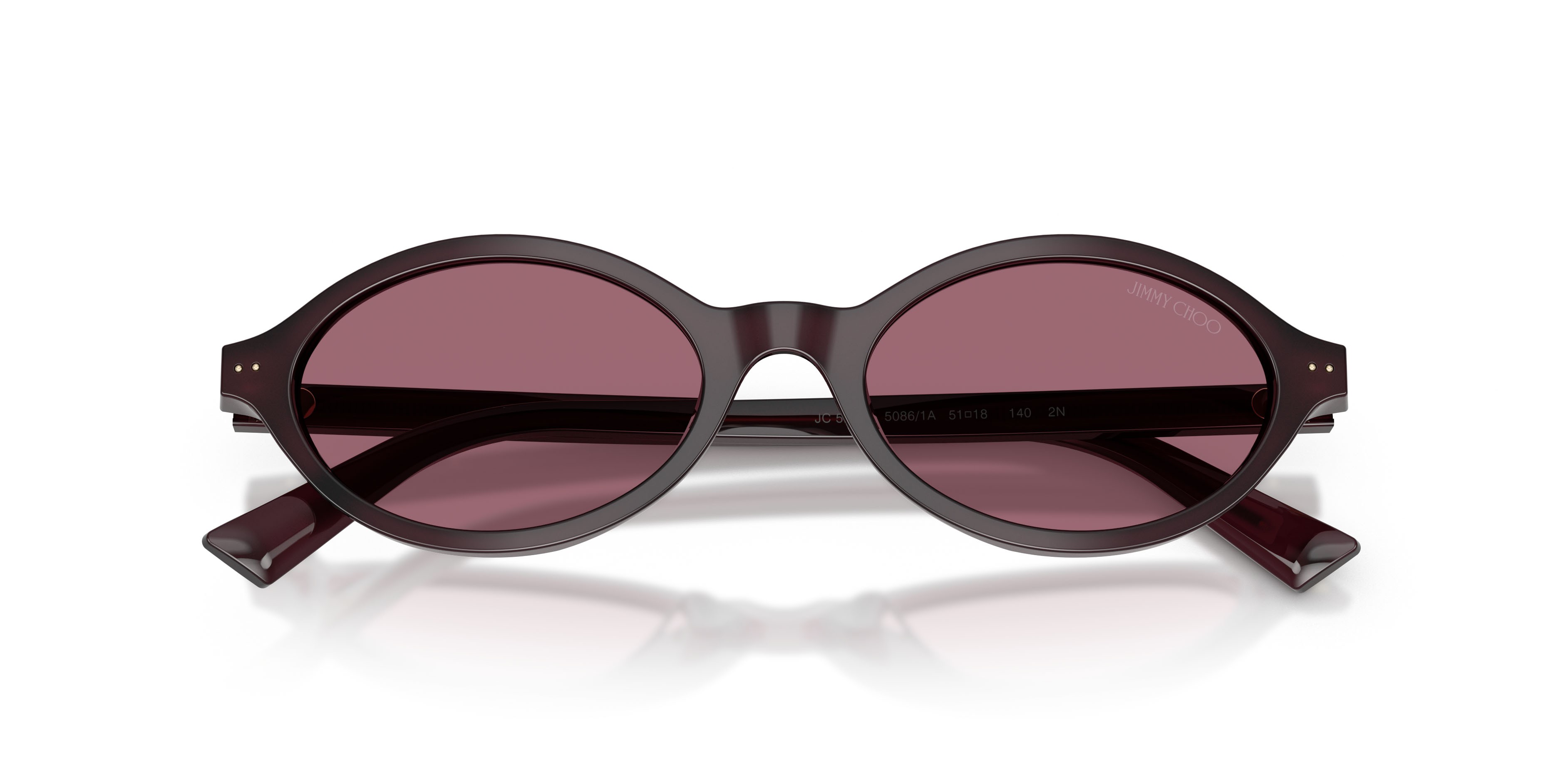 Occhiali da sole Jimmy Choo JC 5068U (50861A) colore prugna opalino forma ovale lenti viola