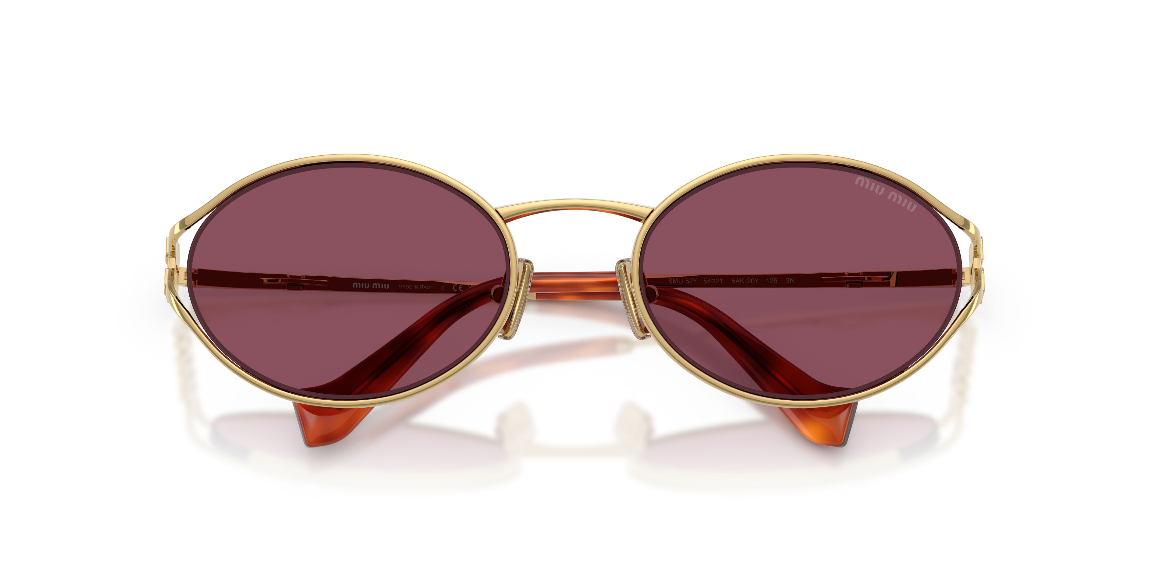Occhiali da sole Miu Miu MU 52YS (5AK20Y) colore oro forma ovale lenti violetto scuro