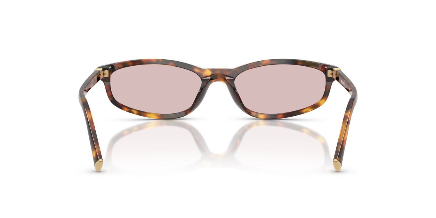 Occhiali da sole Miu Miu MU A06S (14L4I0) colore havana miele forma irregolare lenti rosa