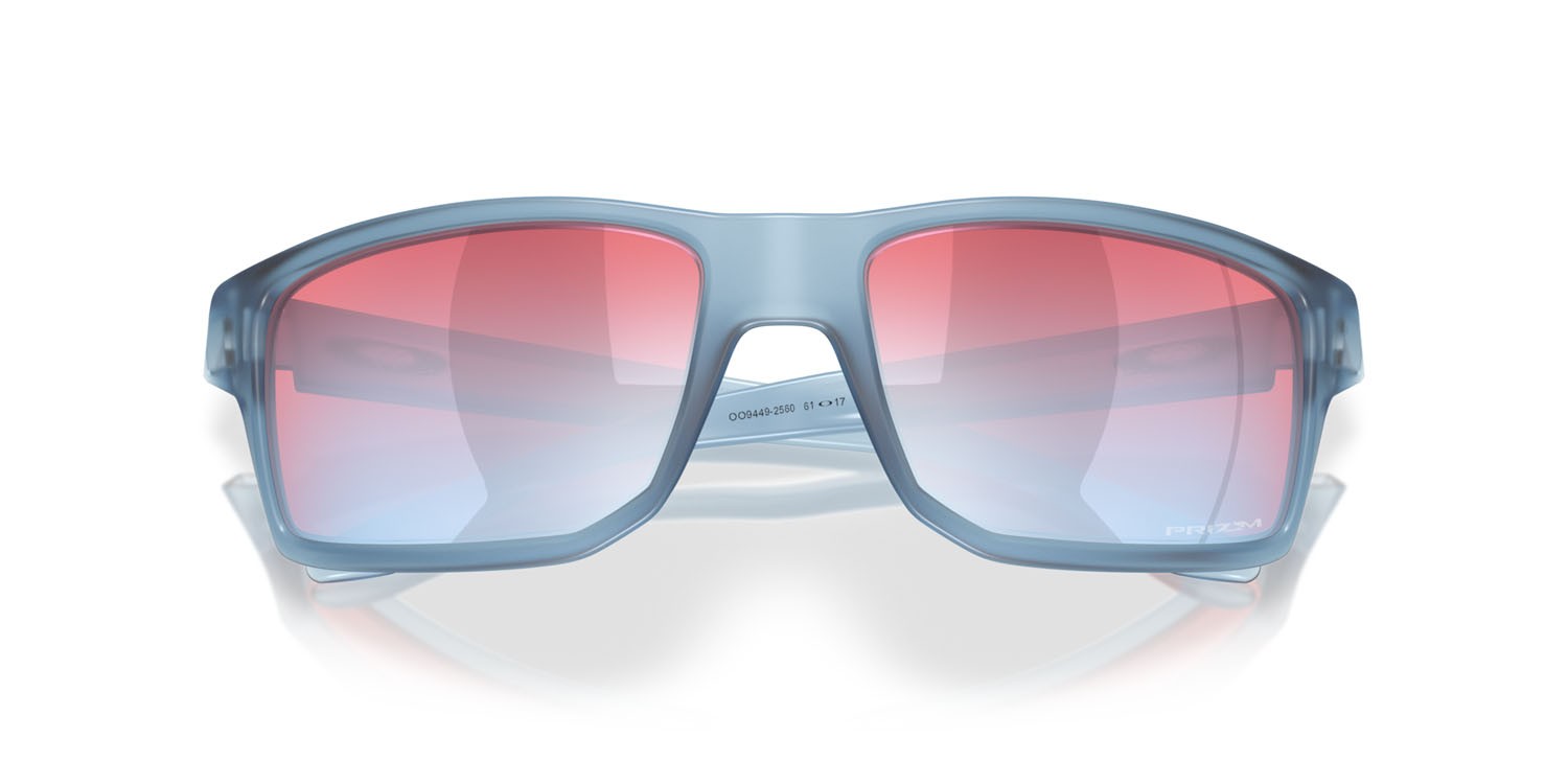 Occhiali da sole Oakley Gibston OO 9449 (944925) colore stonewash trasparente opaco forma rettangolare lenti prizm snow sapphire