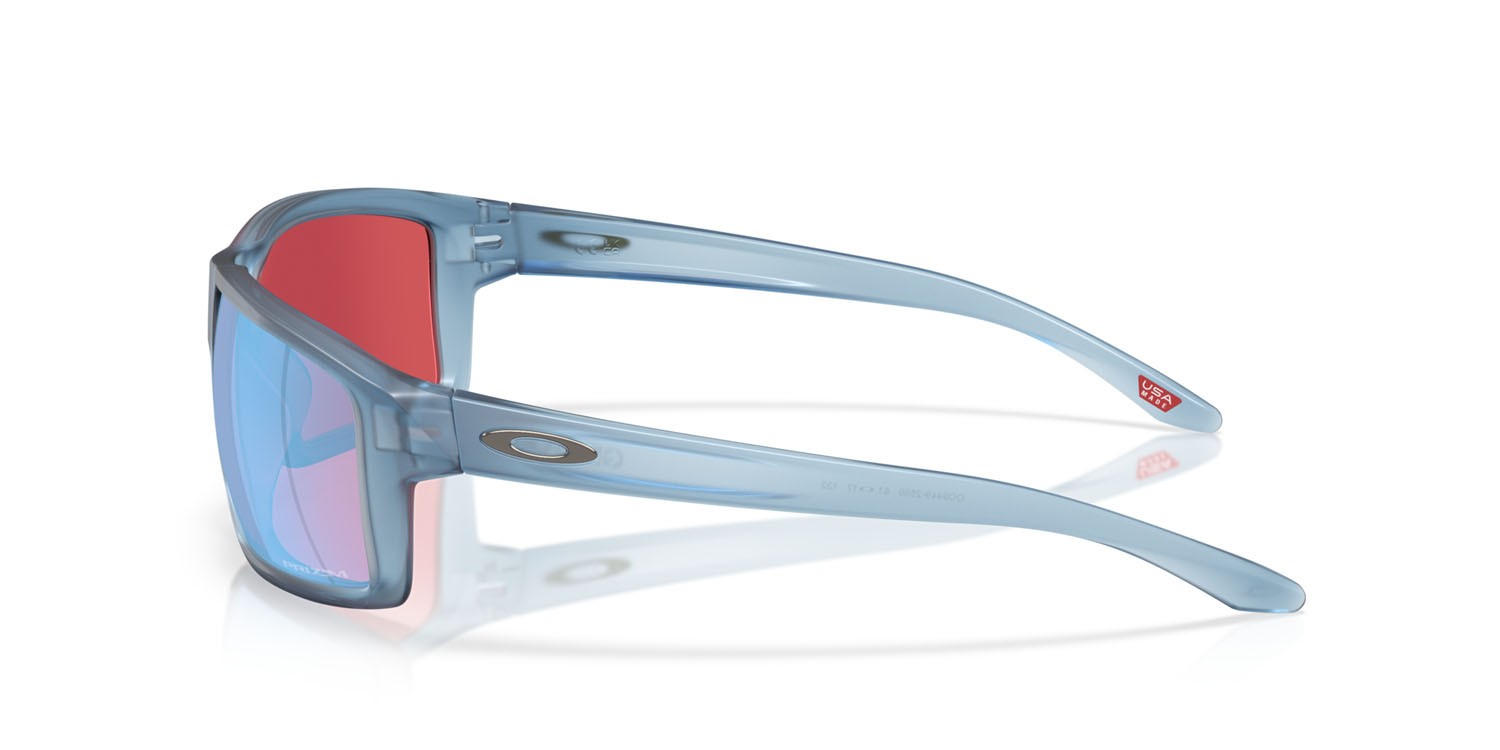 Occhiali da sole Oakley Gibston OO 9449 (944925) colore stonewash trasparente opaco forma rettangolare lenti prizm snow sapphire