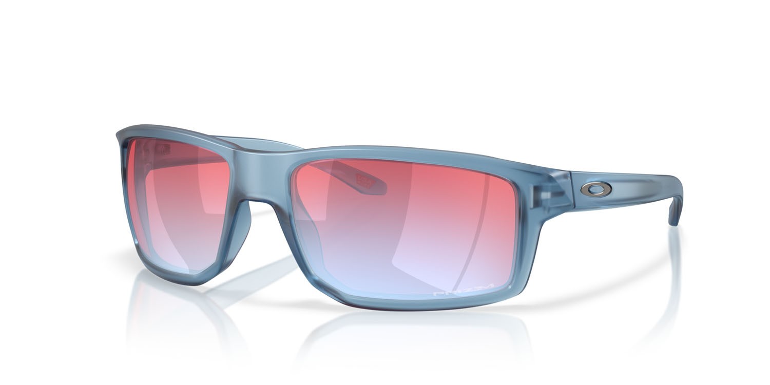 Occhiali da sole Oakley Gibston OO 9449 (944925) colore stonewash trasparente opaco forma rettangolare lenti prizm snow sapphire