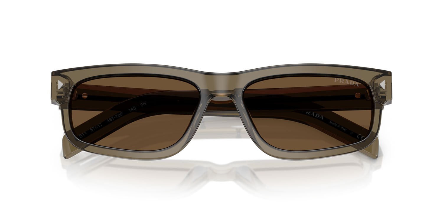 Occhiali da sole Prada PR B11S (18T70F) colore terra trasparente forma rettangolare lenti marrone scuro