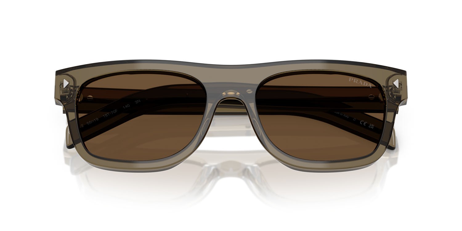 Occhiali da sole Prada PR B12S (18T70F) colore terra trasparente forma quadrato lenti marrone scuro