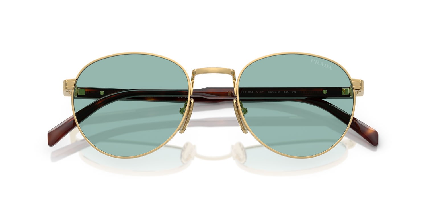 Occhiali da sole Prada PR B51S (5AK40K) colore oro lucido forma ovale lenti lago