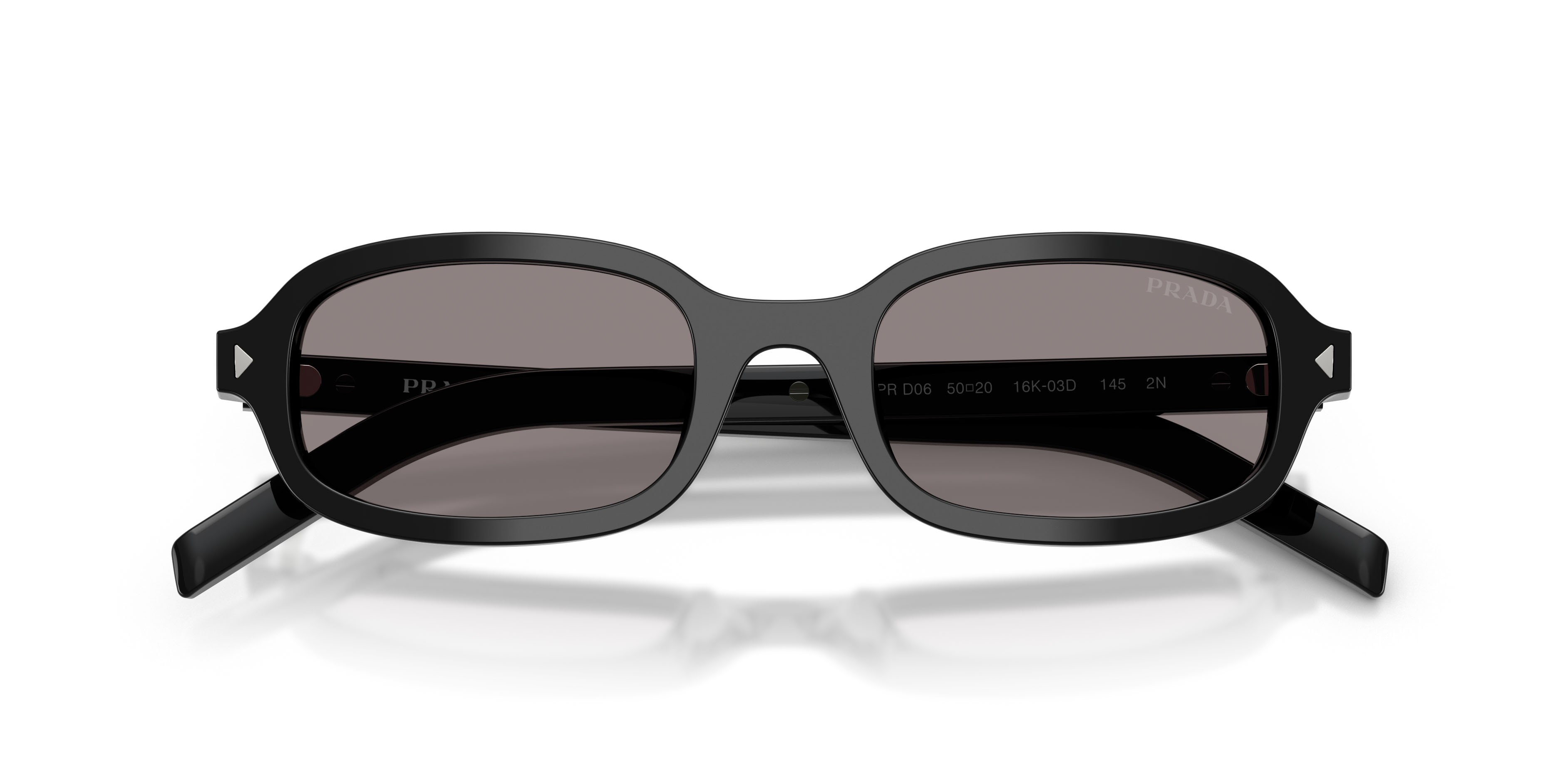 Occhiali da sole Prada PR D06S (16K03D) colore nero forma ovale lenti grigio