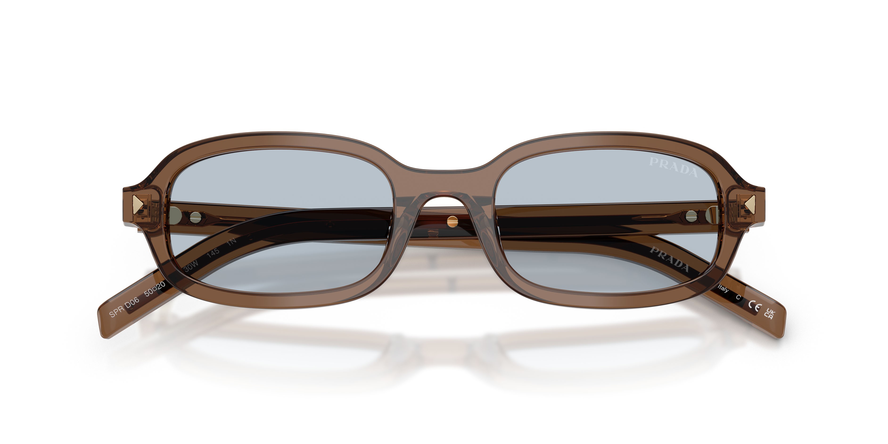 Occhiali da sole Prada PR D06S (28I30W) colore argilla trasparente forma ovale lenti blu/grigio