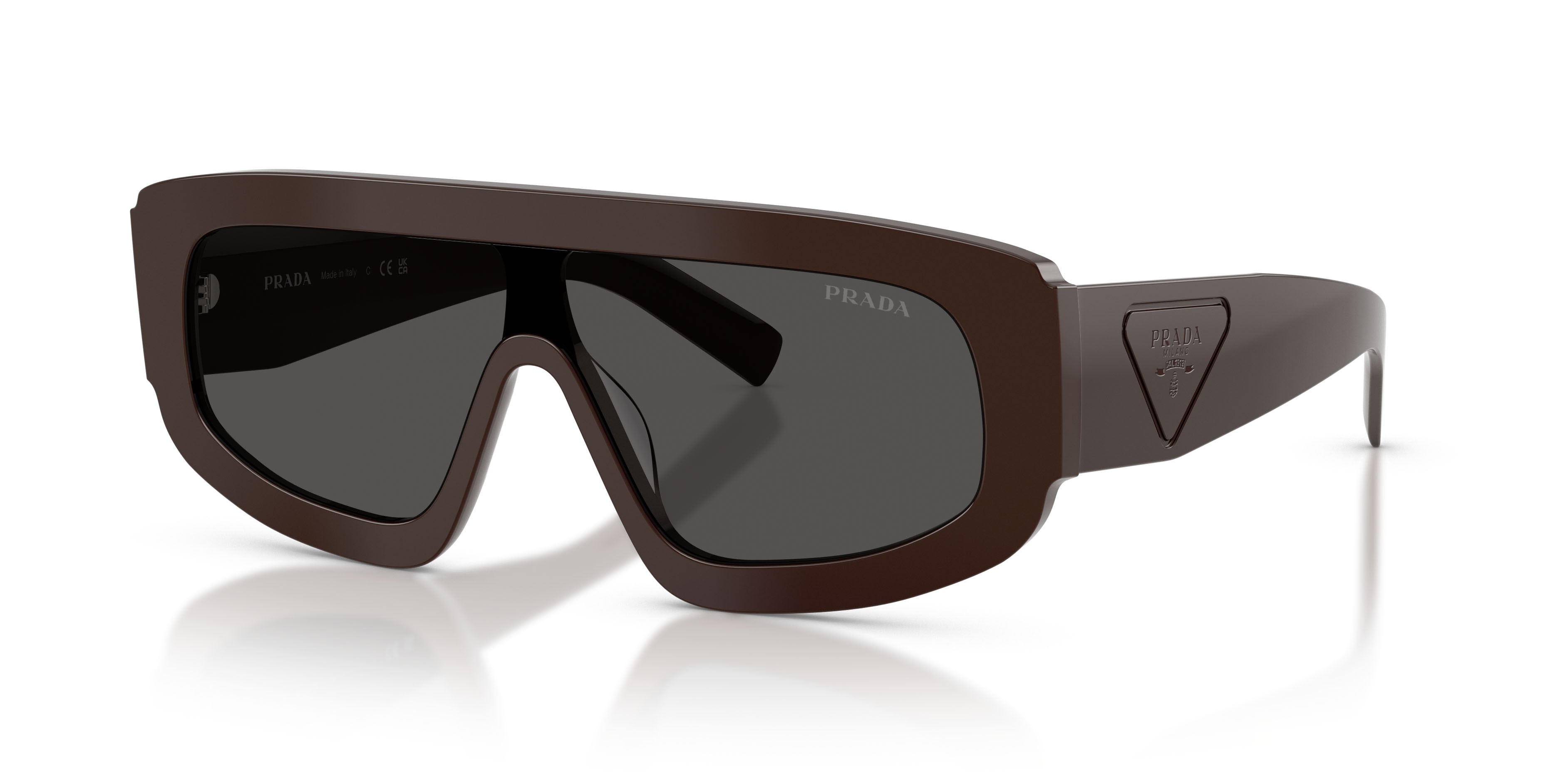 Occhiali da sole Prada PR D10S (27I50P) colore cigar forma irregolare lenti miele scuro
