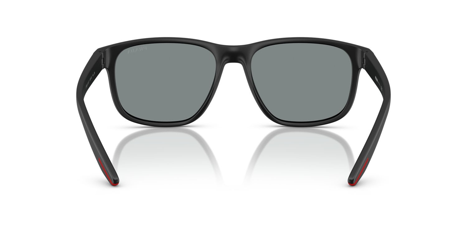 Occhiali da sole Prada Linea Rossa PS 06YS (1BO10J) colore nero opaco forma quadrato lenti blu scuro specchiata viola