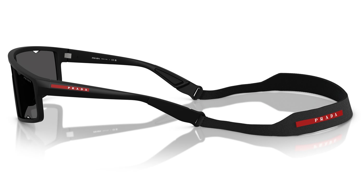 Occhiali da sole Prada Linea Rossa PS A03S (1BO5S0) colore nero opaco forma rettangolare lenti grigio scuro