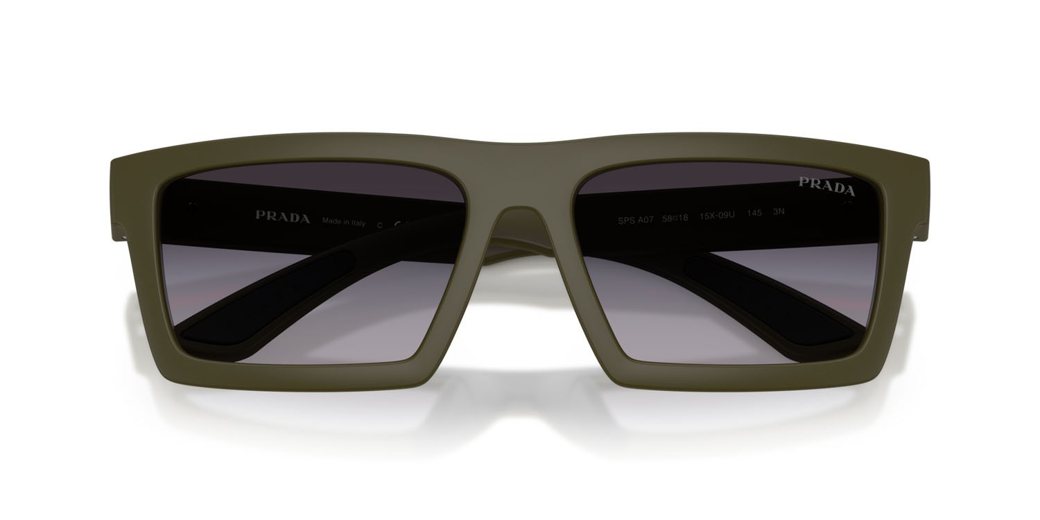 Occhiali da sole Prada Linea Rossa PS A07S (15X09U) colore verde opaco/nero effetto gommato forma rettangolare lenti sfumato grigio