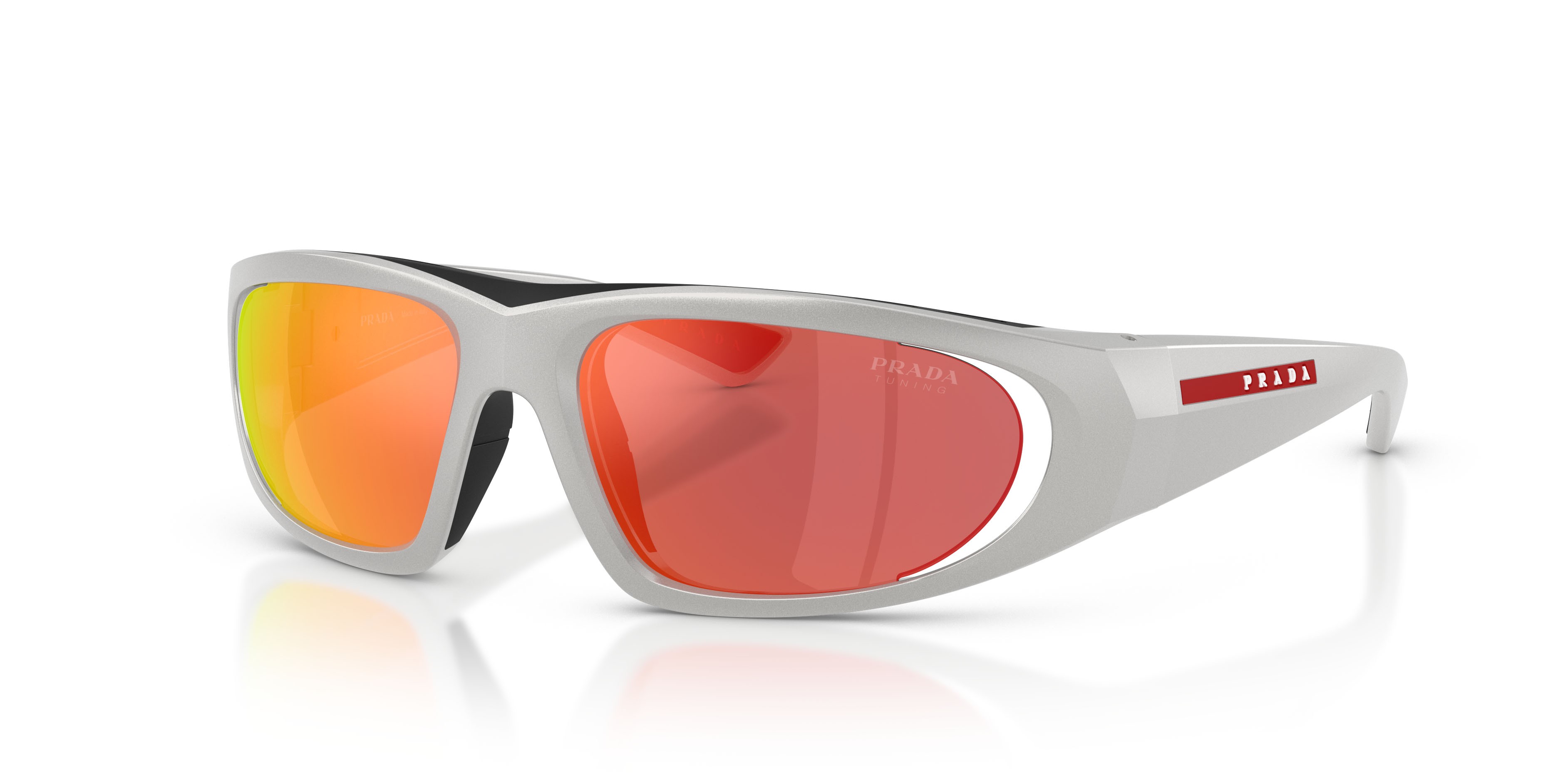 Occhiali da sole Prada Linea Rossa PS B03S (14Z04U) colore grigio metallizzato forma irregolare lenti dark grey mirror orange tuning