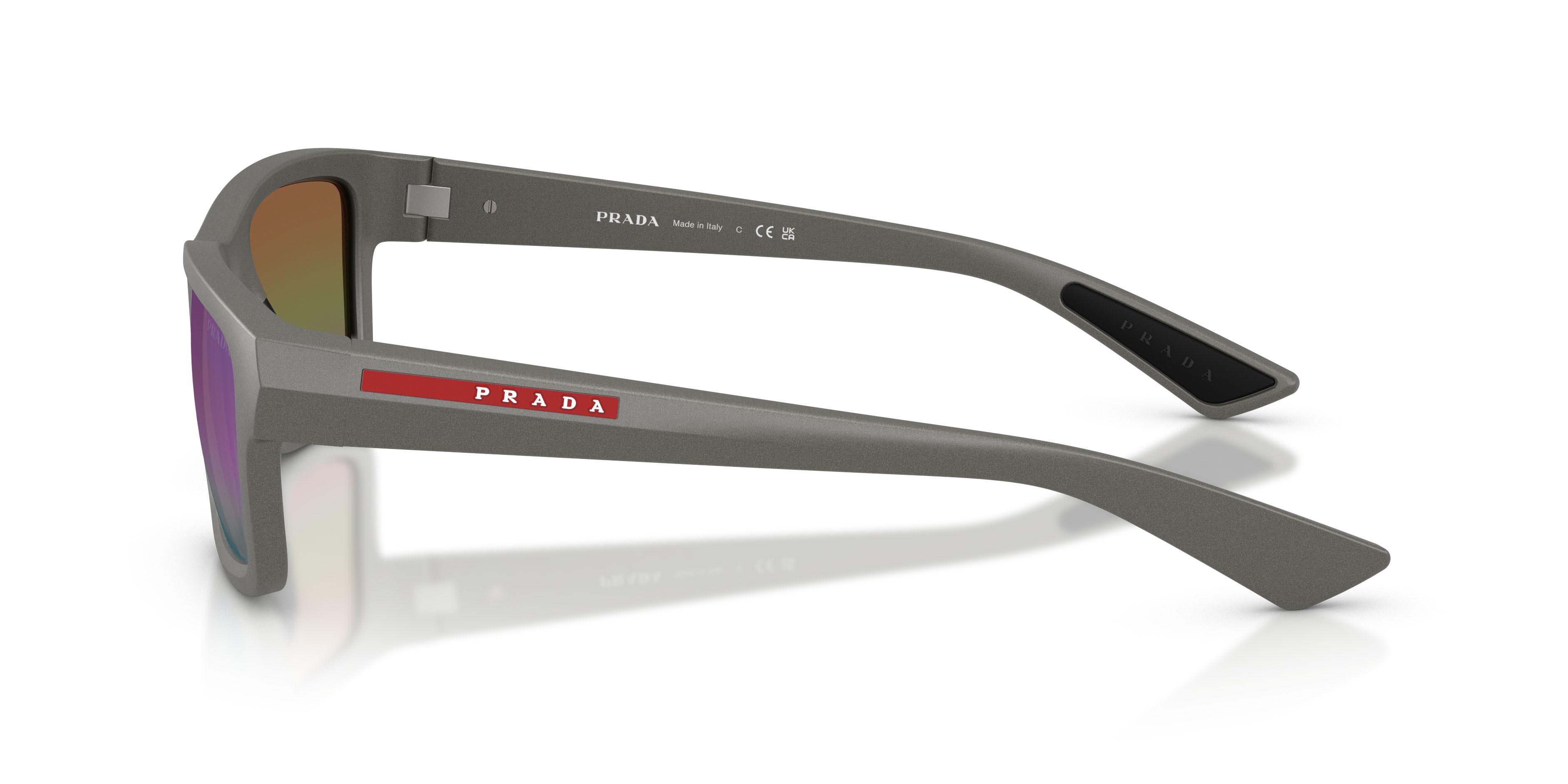 Occhiali da sole Prada Linea Rossa PS B10S (16X50Z) colore silver metal forma irregolare lenti violetto sfumato argento