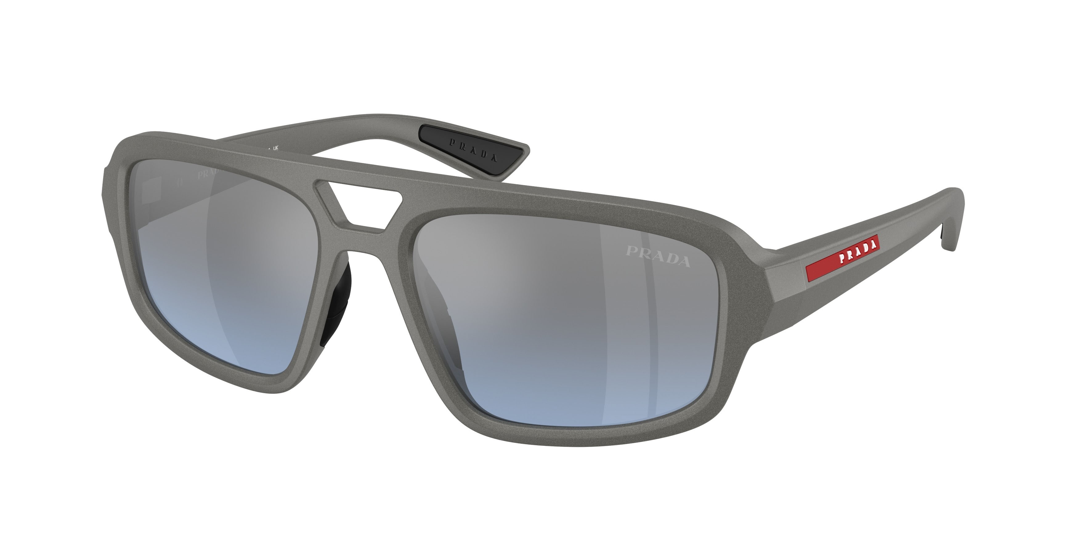 Occhiali da sole Prada Linea Rossa PS B11SU (16X11A) colore grigio metallizzato forma irregolare lenti celeste sfumato argento a specchio