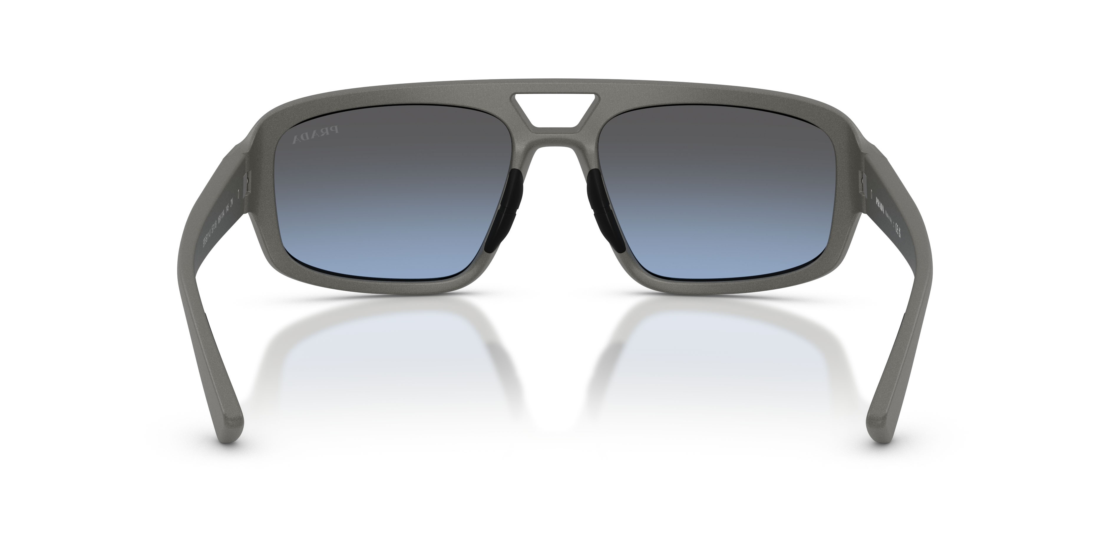Occhiali da sole Prada Linea Rossa PS B11SU (16X11A) colore grigio metallizzato forma irregolare lenti celeste sfumato argento a specchio