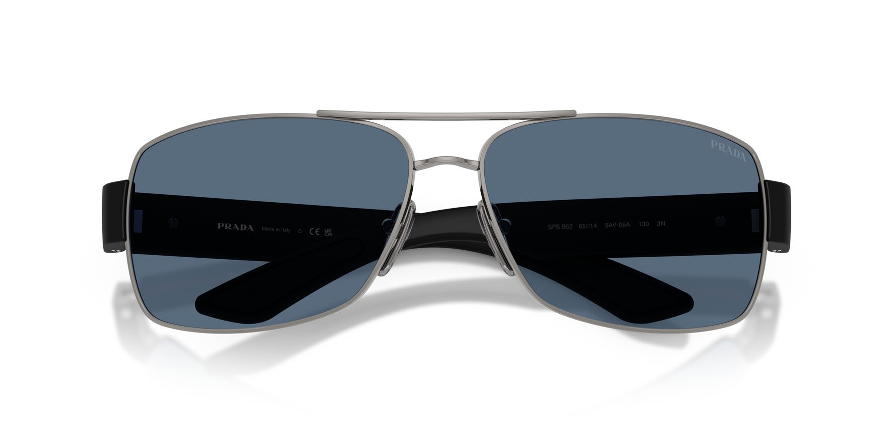Occhiali da sole Prada Linea Rossa PS B52S (5AV06A) colore gunmetal forma irregolare lenti blu scuro
