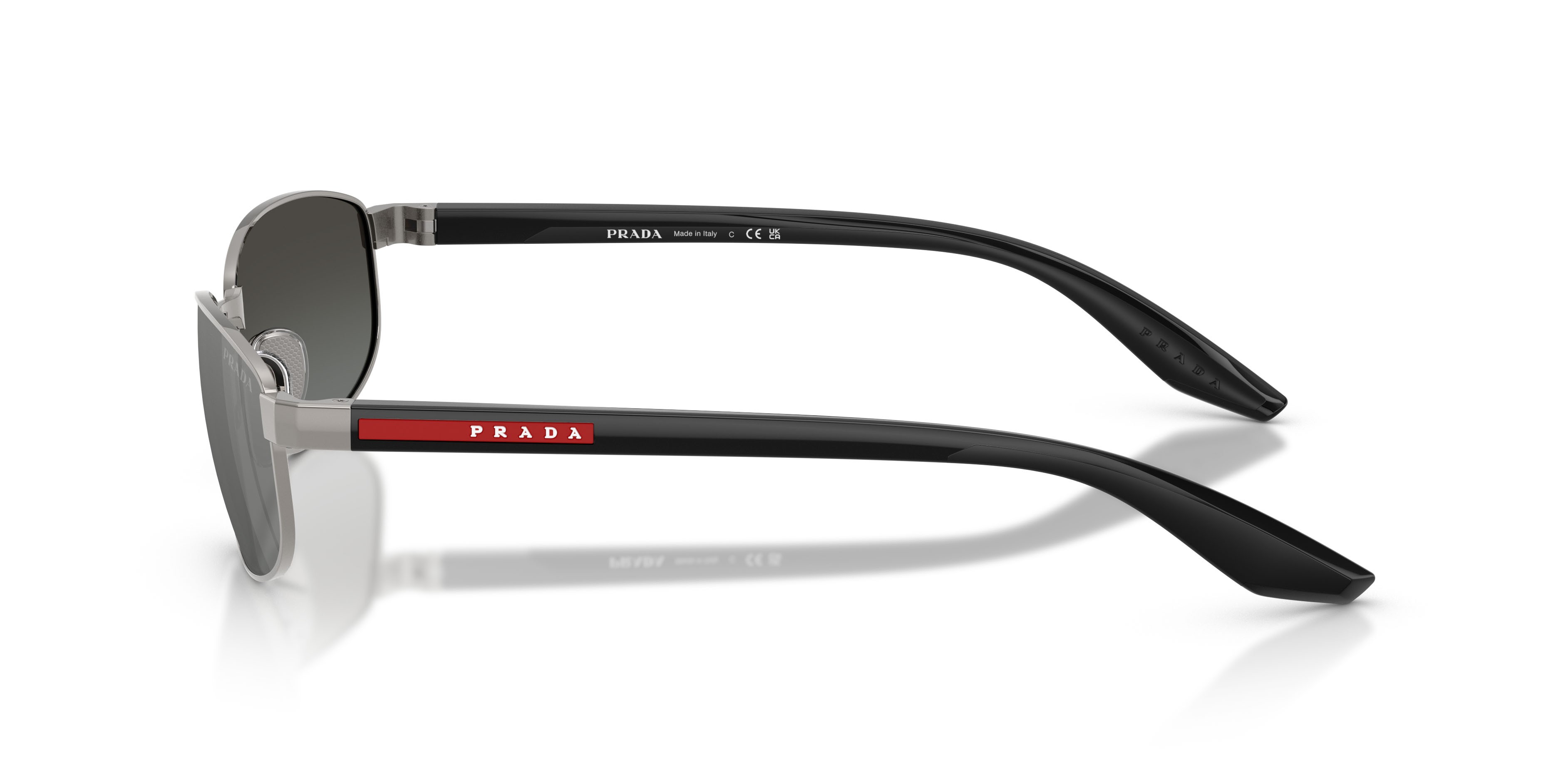 Occhiali da sole Prada Linea Rossa PS B53S (5AV41A) colore grigio metallizzato forma ovale lenti grigio sfumato argento a specchio