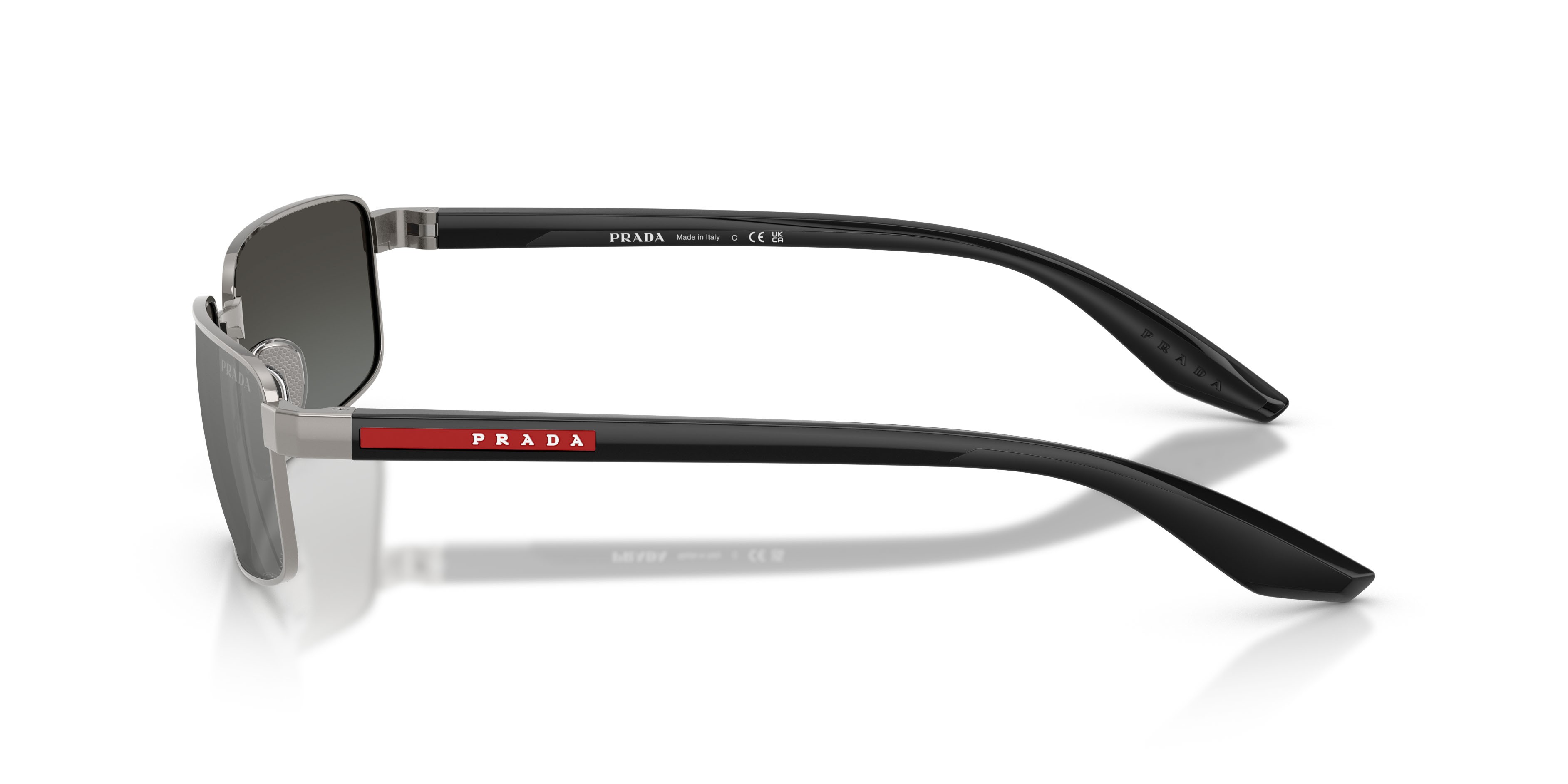 Occhiali da sole Prada Linea Rossa PS B54S (5AV41A) colore grigio metallizzato forma rettangolare lenti grigio/argento
