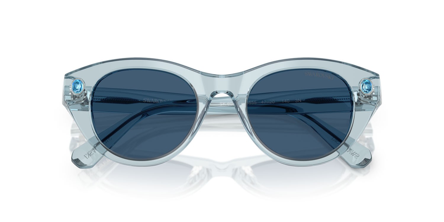 Sunglasses Swarovski SK 6025 (106555) color azzurro trasparente shape round lenses blu scuro