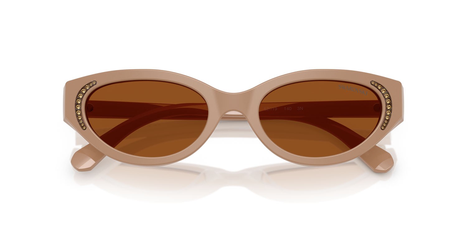 Sunglasses Swarovski SK 6030 (106173) color beige shape round lenses marrone scuro