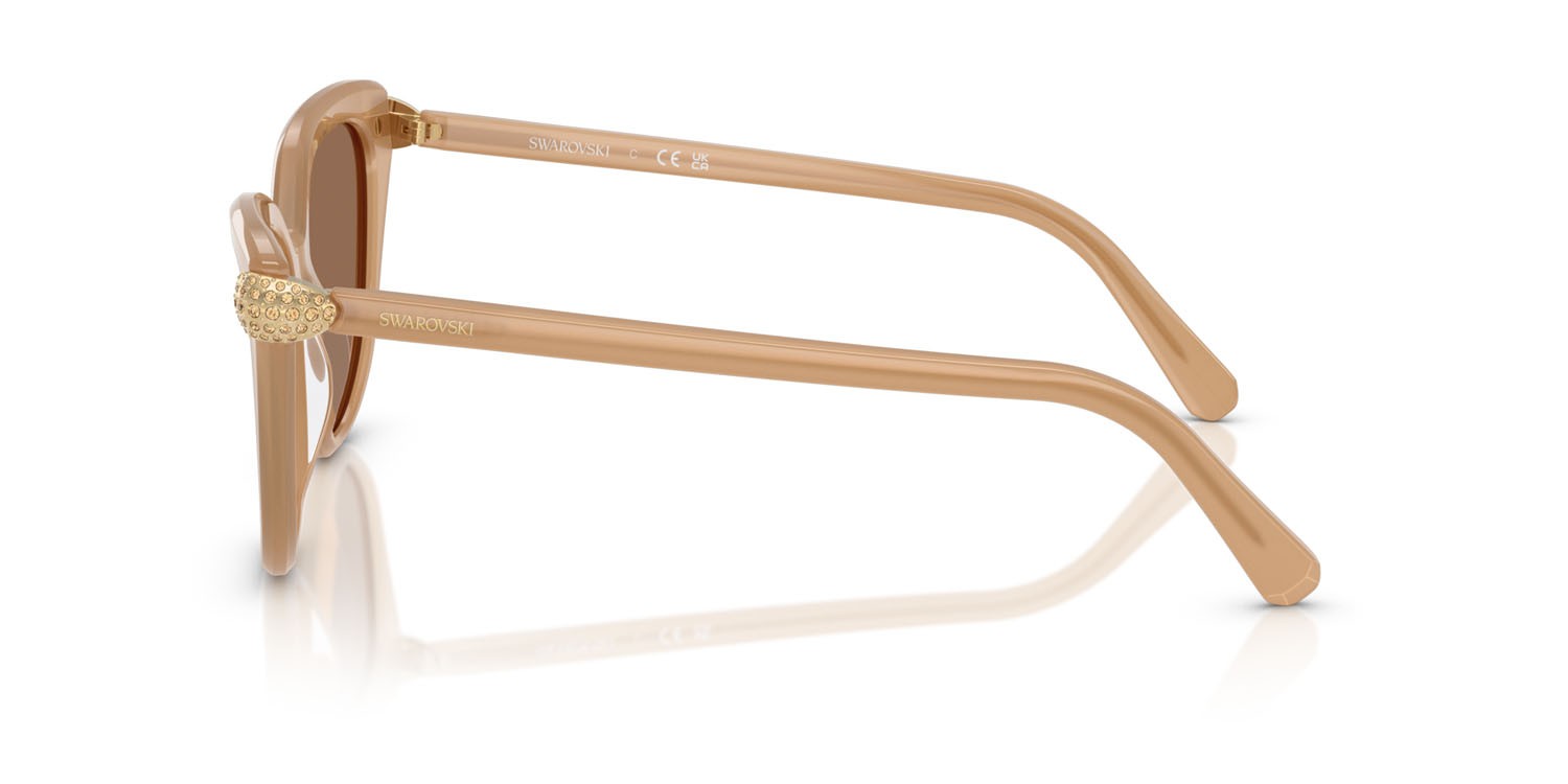 Occhiali da sole Swarovski SK 6039 (2002OK) colore beige perlaceo forma cat eye lenti bronzo