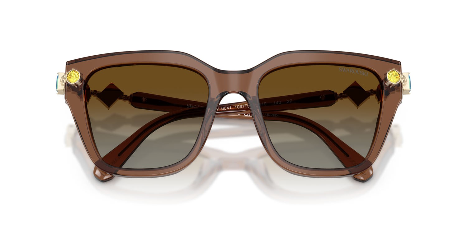 Sunglasses Swarovski SK 6041 (1067T5) color marrone trasparente shape irregular lenses polarizzata marrone sfumato