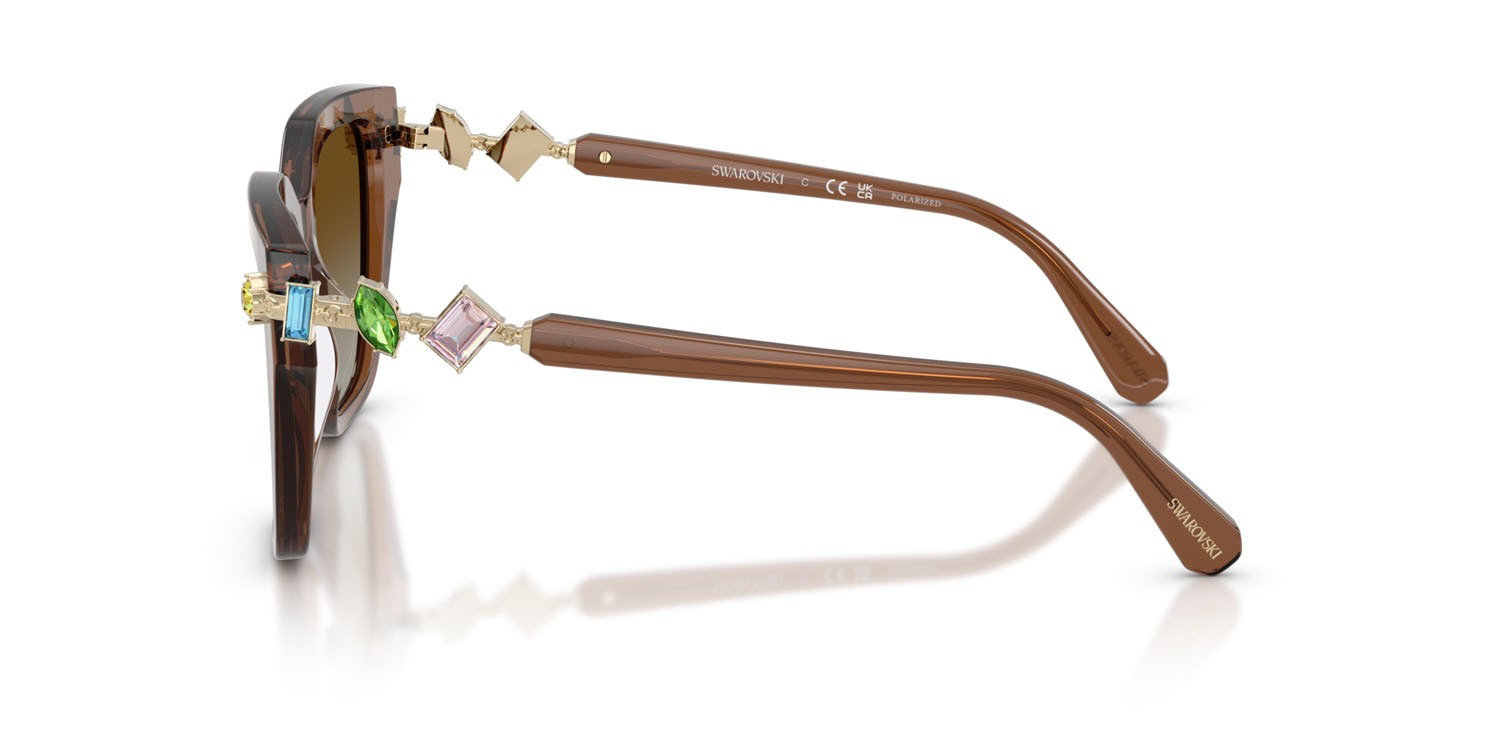 Sunglasses Swarovski SK 6041 (1067T5) color marrone trasparente shape irregular lenses polarizzata marrone sfumato