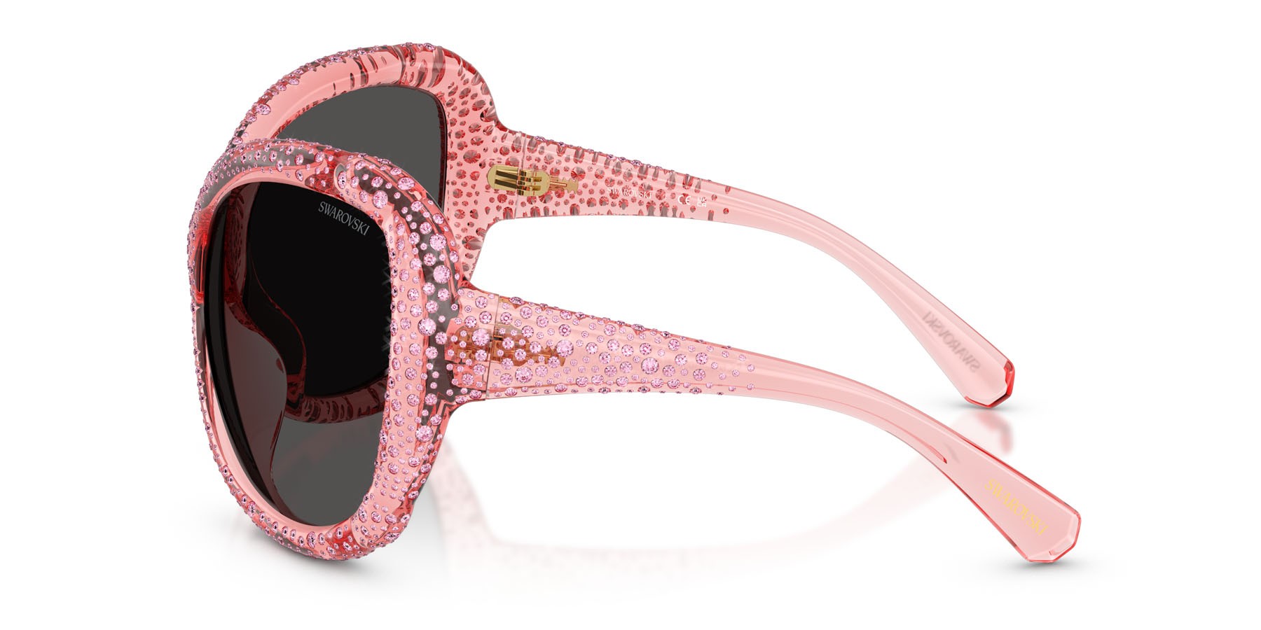 Occhiali da sole Swarovski SK 6052 (108887) colore rosa trasparente forma farfalla lenti grigio scuro