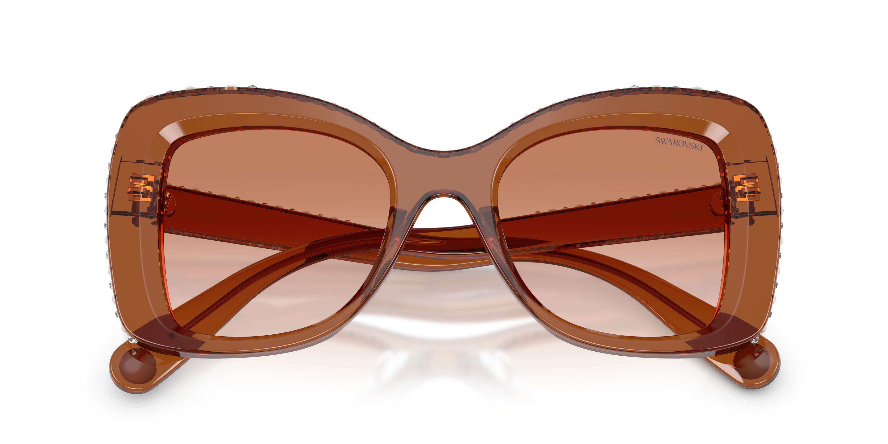 Sunglasses Swarovski SK 6062U (109573) color marrone trasparente shape butterfly lenses marrone sfumato