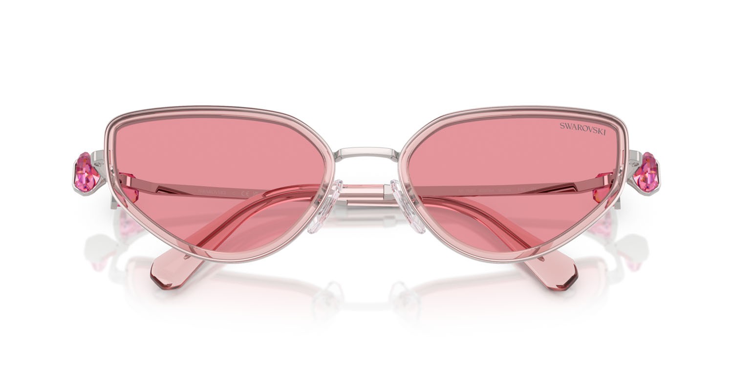 Sunglasses Swarovski SK 7027 (403784) color argento/rosa shape irregular lenses rosa