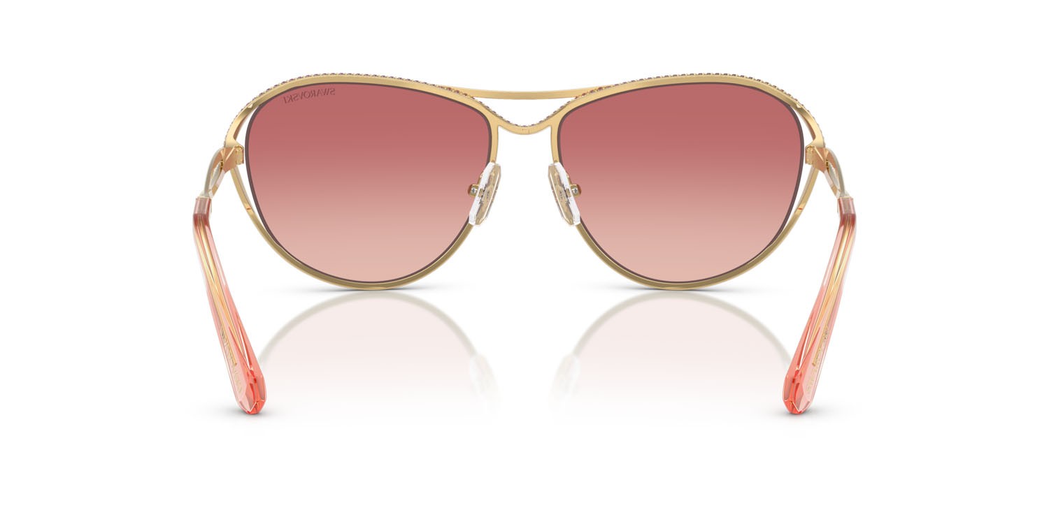 Sunglasses Swarovski SK 7028 (4004A5) color oro shape aviator lenses rosa sfumato rosso