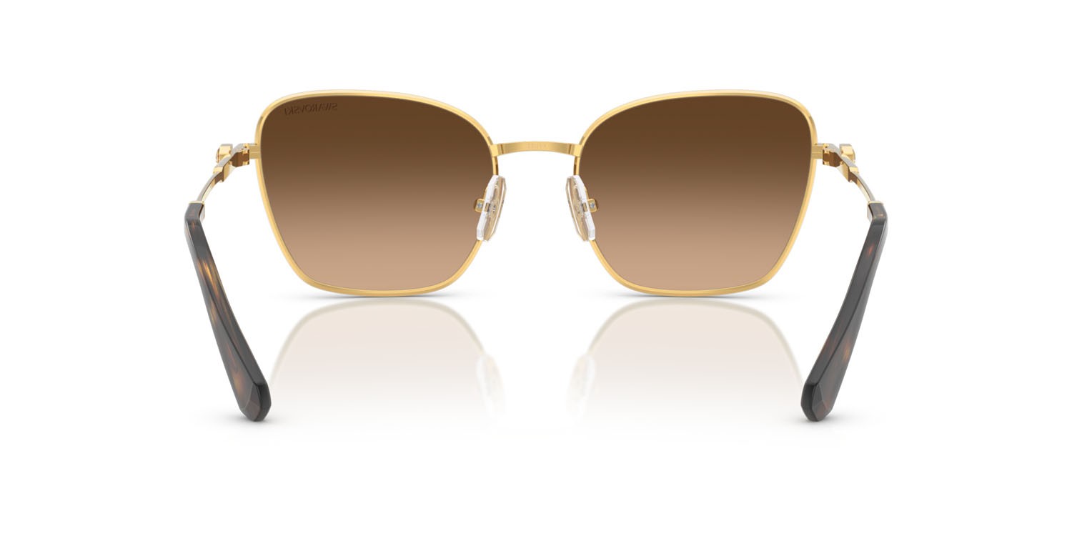 Sunglasses Swarovski SK 7029 (400774) color giallo oro shape aviator lenses verde sfumato marrone