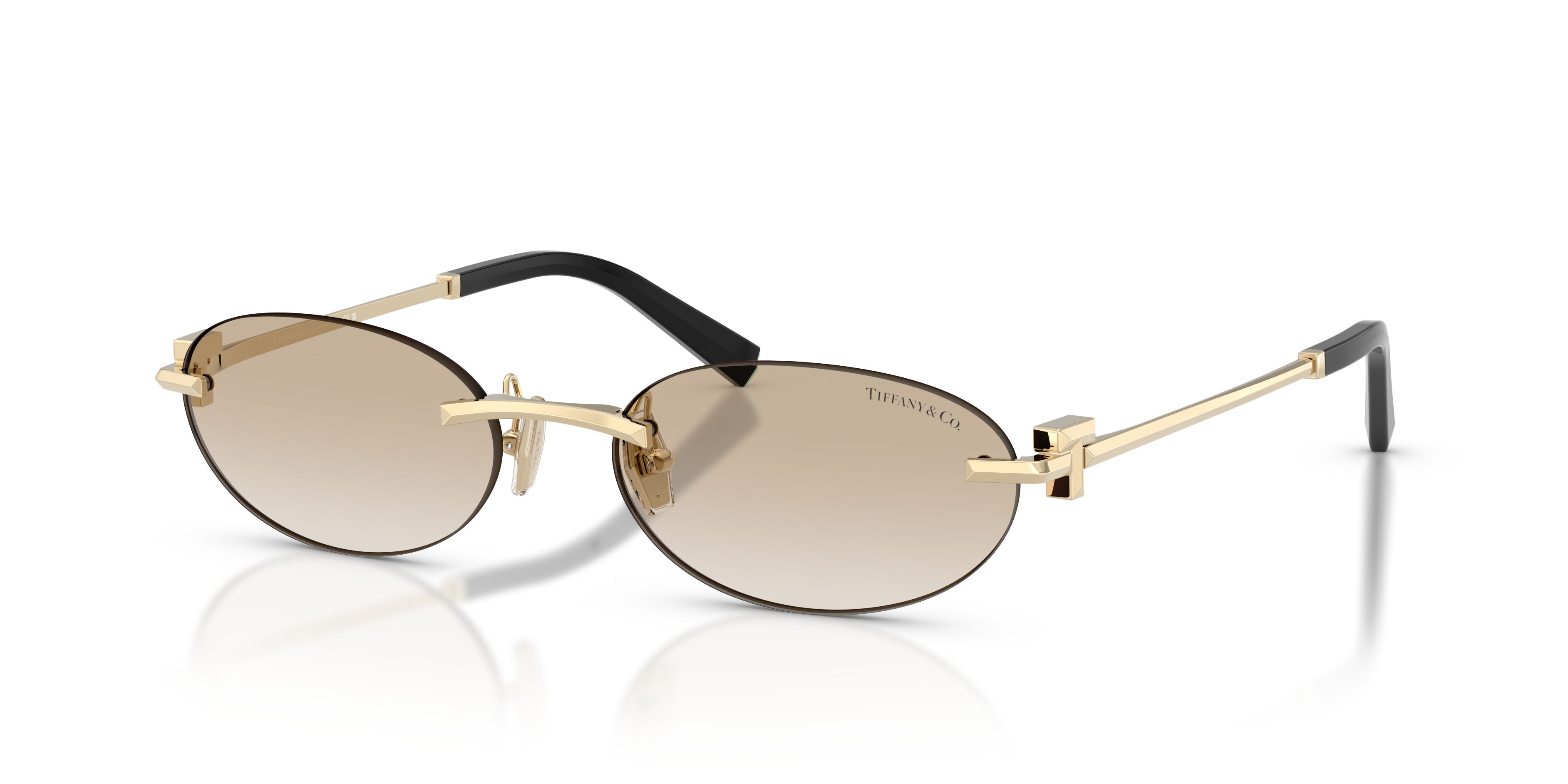 Occhiali da sole Tiffany TF 3119D (623911) colore oro pallido forma ovale lenti trasparente sfumato grigio chiaro