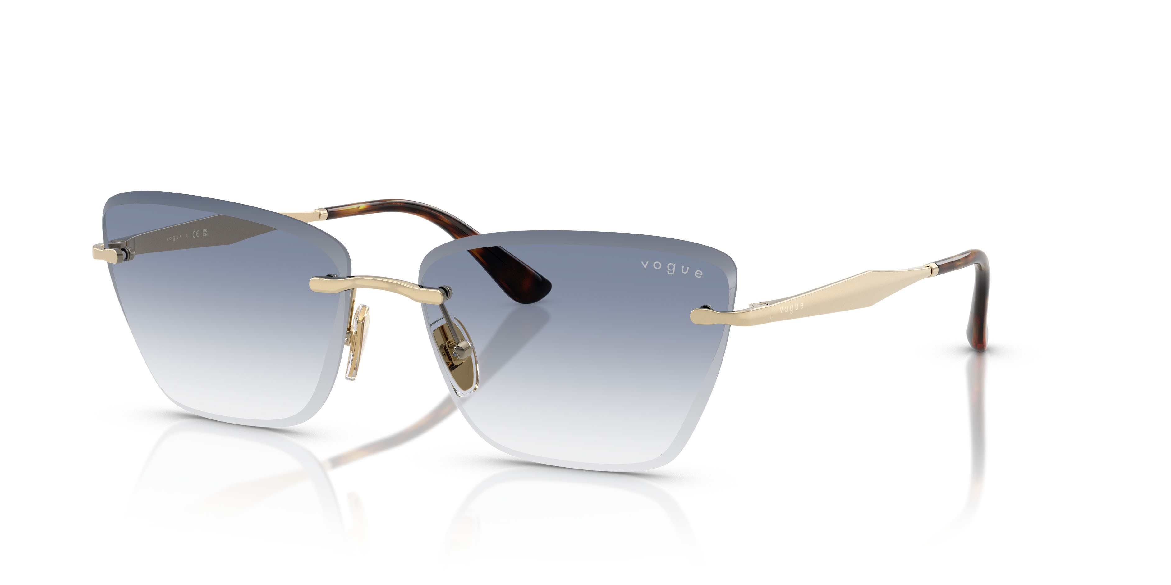 Occhiali da sole Vogue VO 4332S (848/19) colore oro pallido forma cat eye lenti trasparente sfumato azzurro