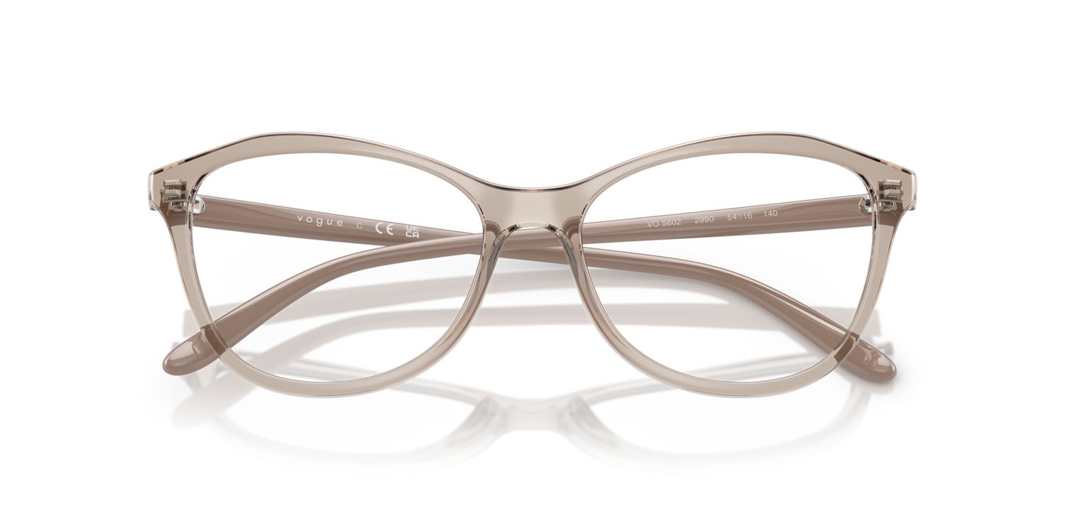 Eyeglasses Vogue VO 5602 (2990) color caramello trasparente shape irregular lenses lente demo