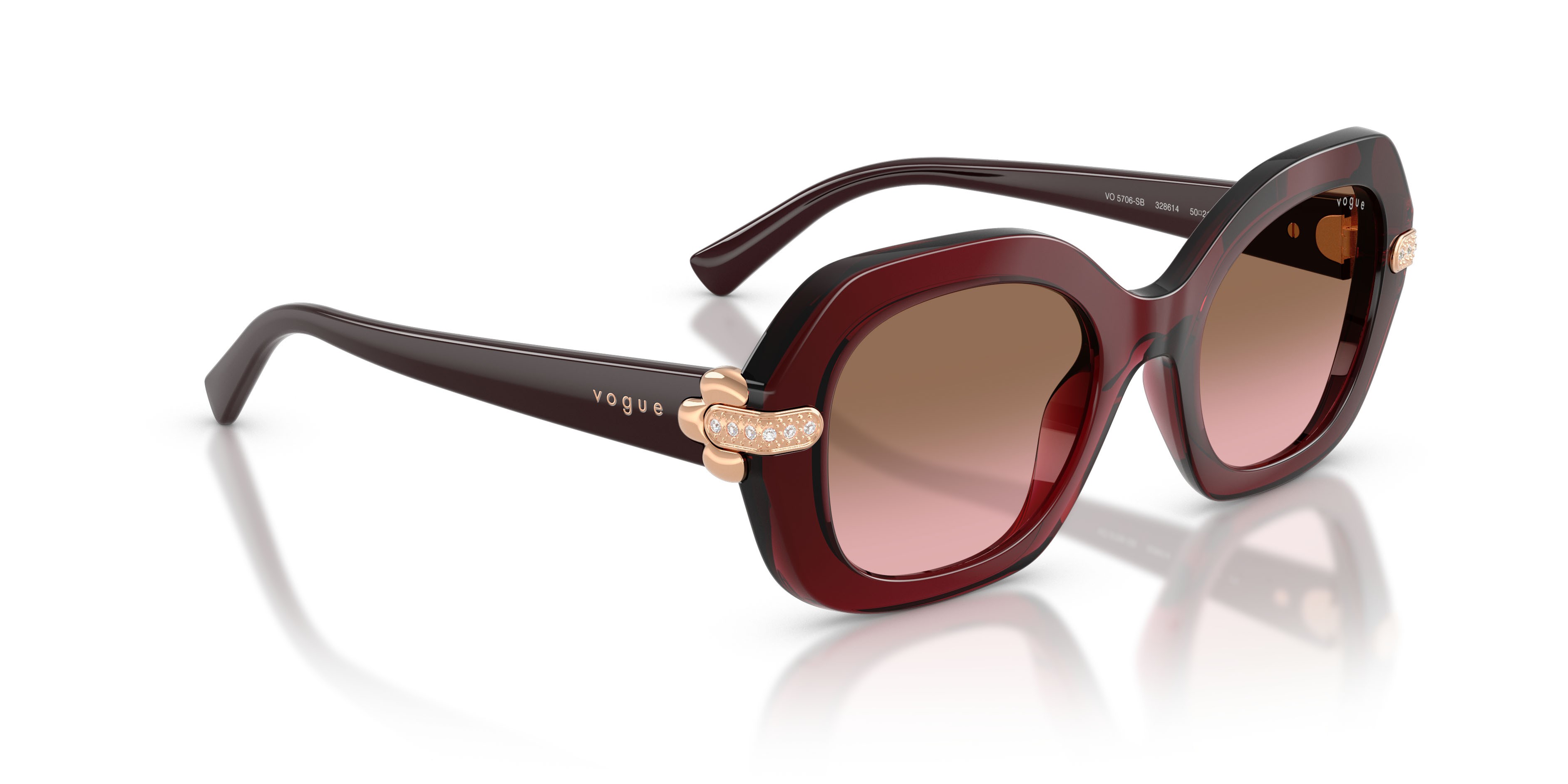 Occhiali da sole Vogue VO 5706SB (328614) colore bordeaux trasparente forma irregolare lenti rosa sfumato marrone