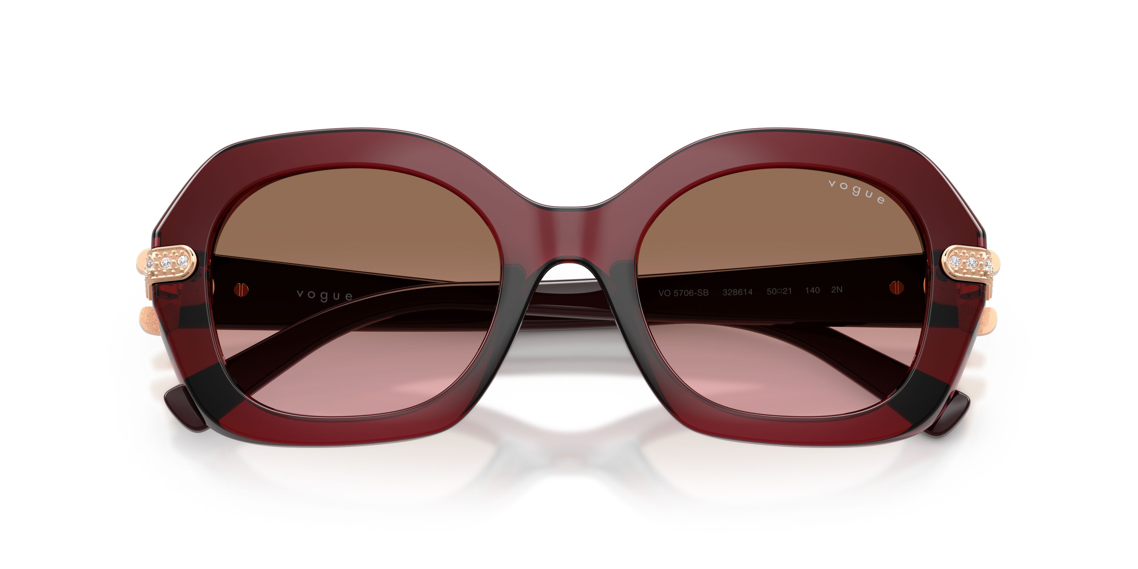 Occhiali da sole Vogue VO 5706SB (328614) colore bordeaux trasparente forma irregolare lenti rosa sfumato marrone