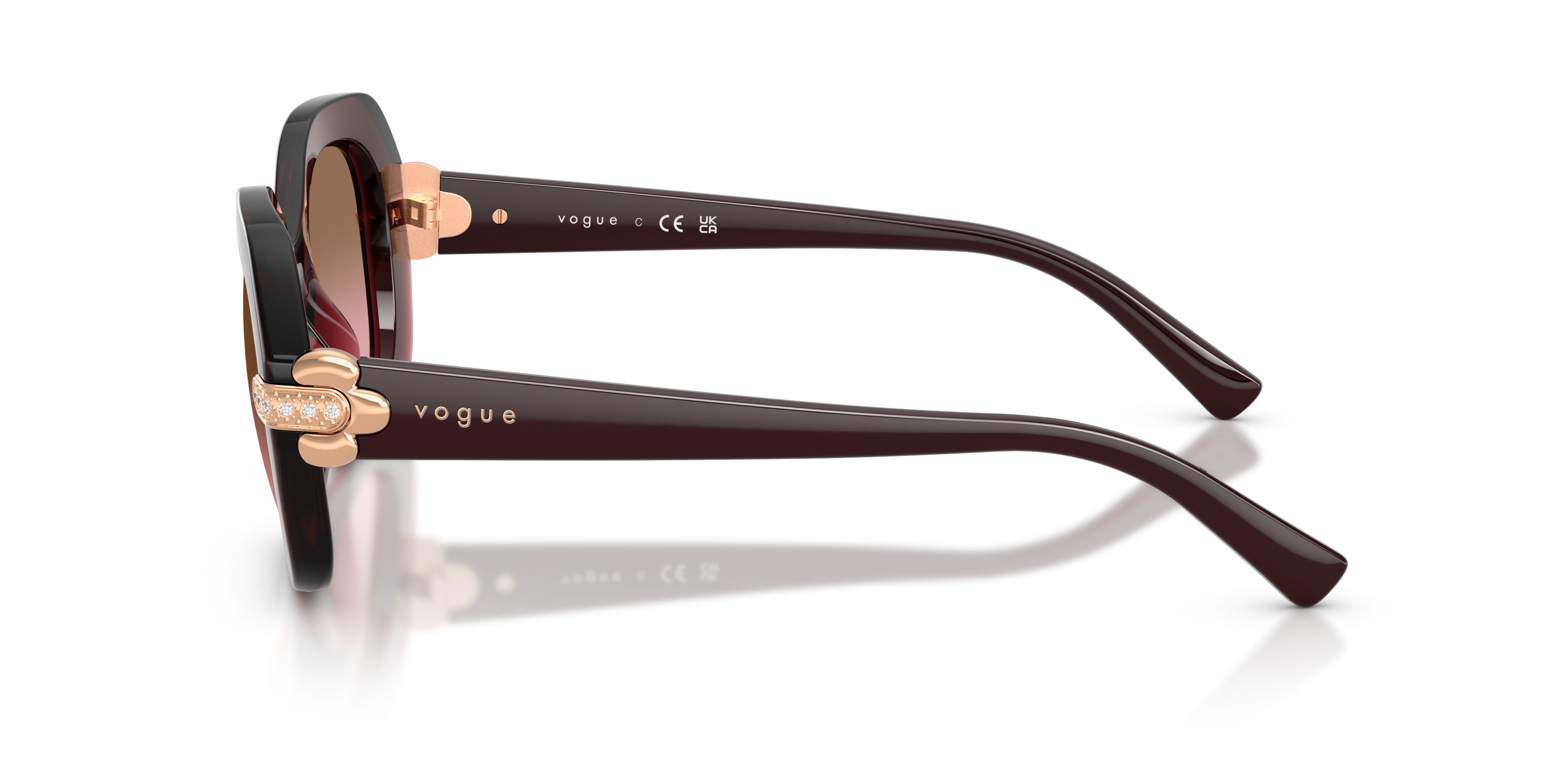 Occhiali da sole Vogue VO 5706SB (328614) colore bordeaux trasparente forma irregolare lenti rosa sfumato marrone