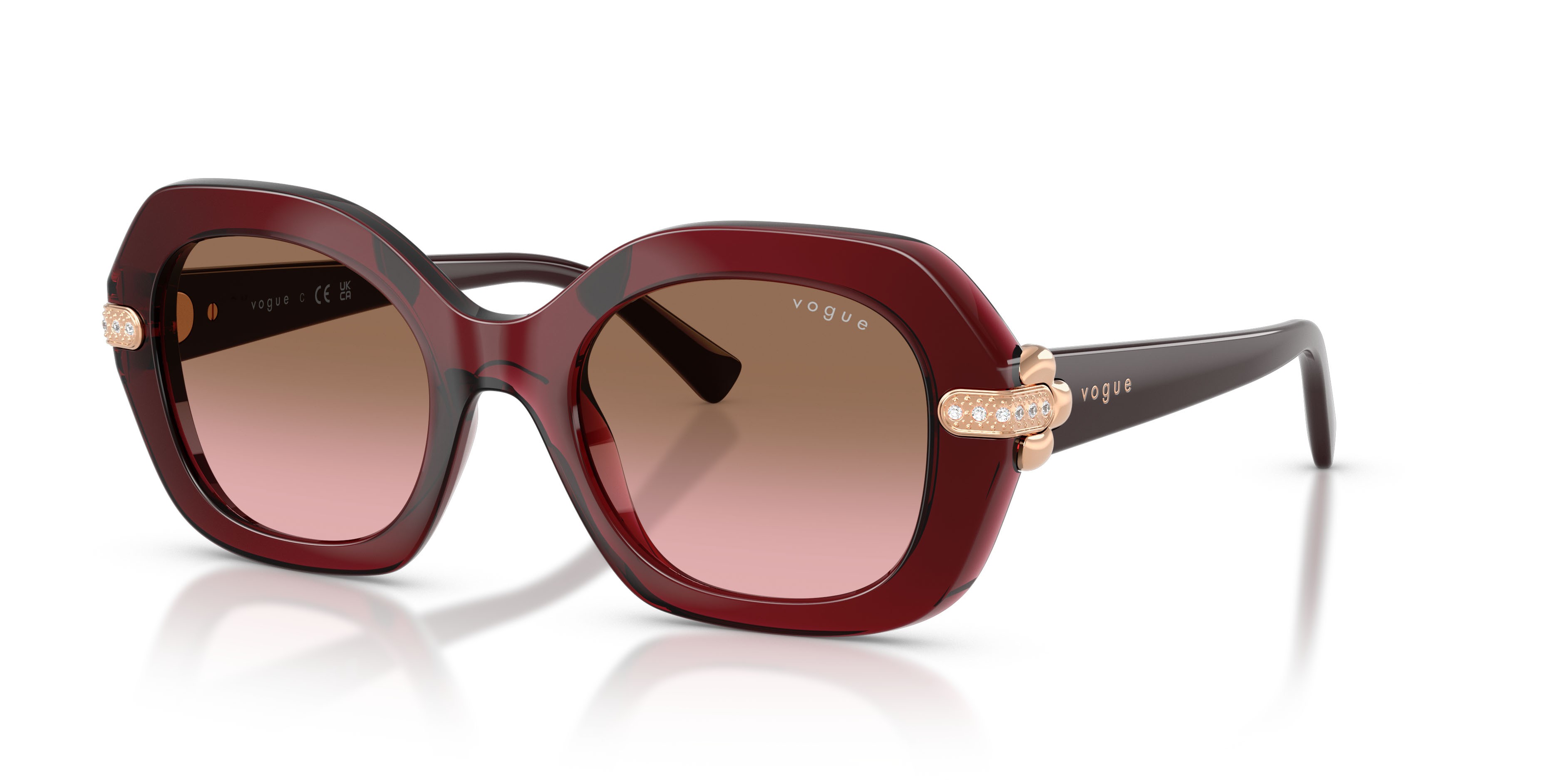 Occhiali da sole Vogue VO 5706SB (328614) colore bordeaux trasparente forma irregolare lenti rosa sfumato marrone