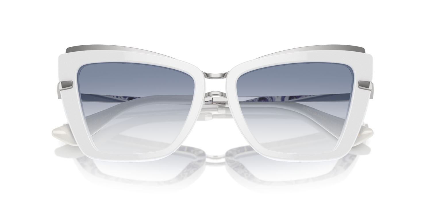 Occhiali da sole Dolce & Gabbana DG 4472 (337119) colore bianco su maiolica blu forma cat eye lenti trasparente sfumato azzurro