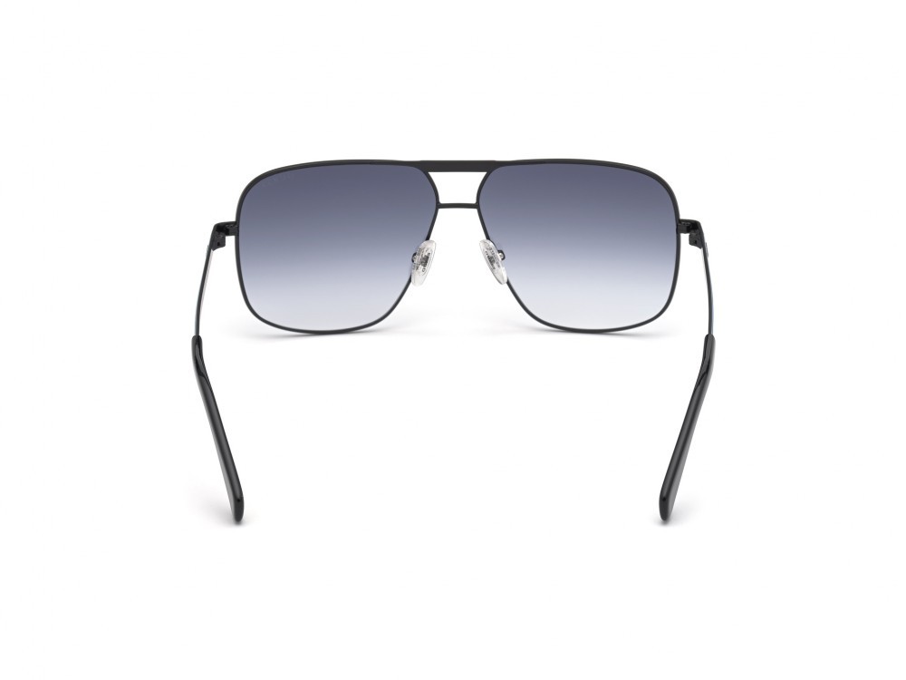 Occhiali da sole Guess GU00026 (02W) colore nero opaco forma navigator lenti blu grad.