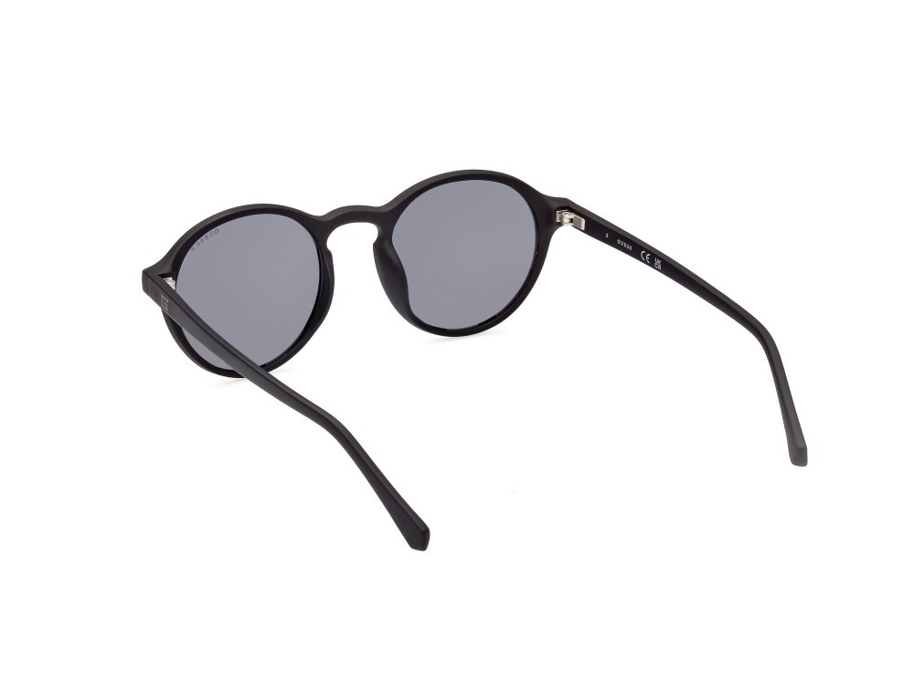 Occhiali da sole Guess GU00062 (02D) colore nero opaco forma rotondo lenti fumo polar.