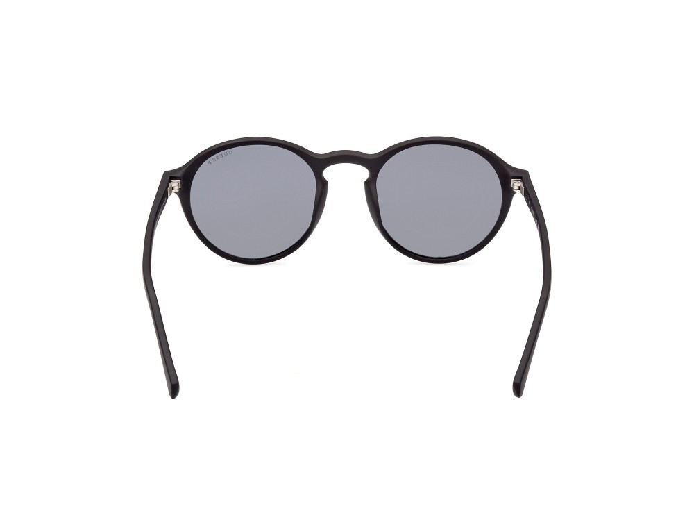 Occhiali da sole Guess GU00062 (02D) colore nero opaco forma rotondo lenti fumo polar.