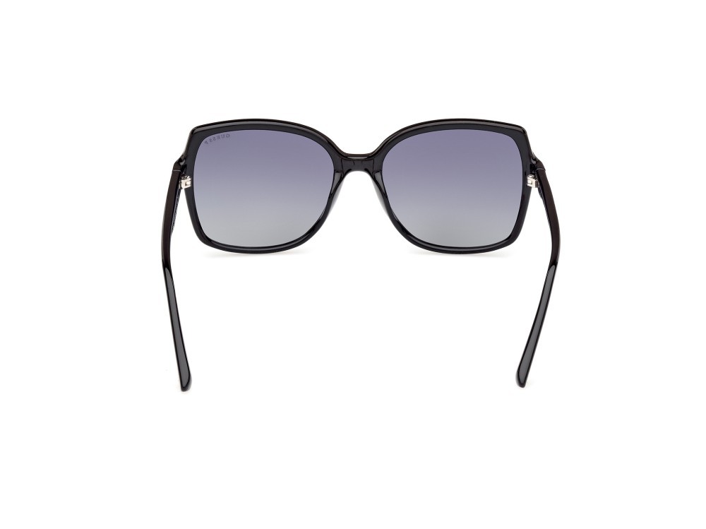 Occhiali da sole Guess GU00100 (01D) colore nero lucido forma quadrato lenti fumo polar.