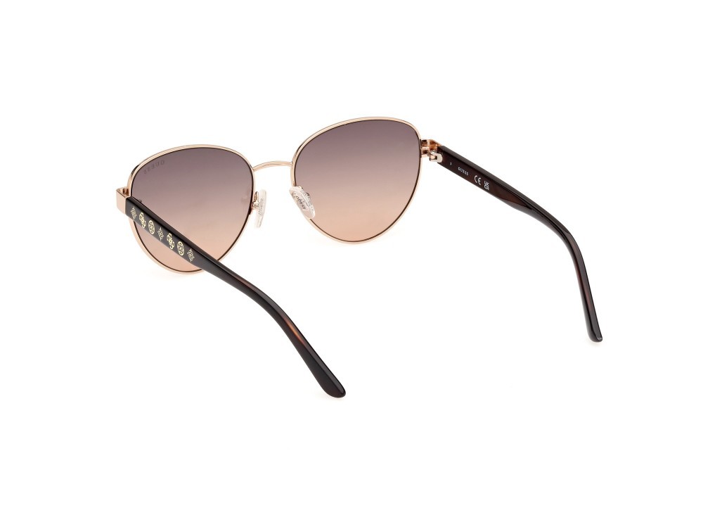 Occhiali da sole Guess GU00101 (32F) colore oro pallido lucido forma rotondo lenti marrone sfumato