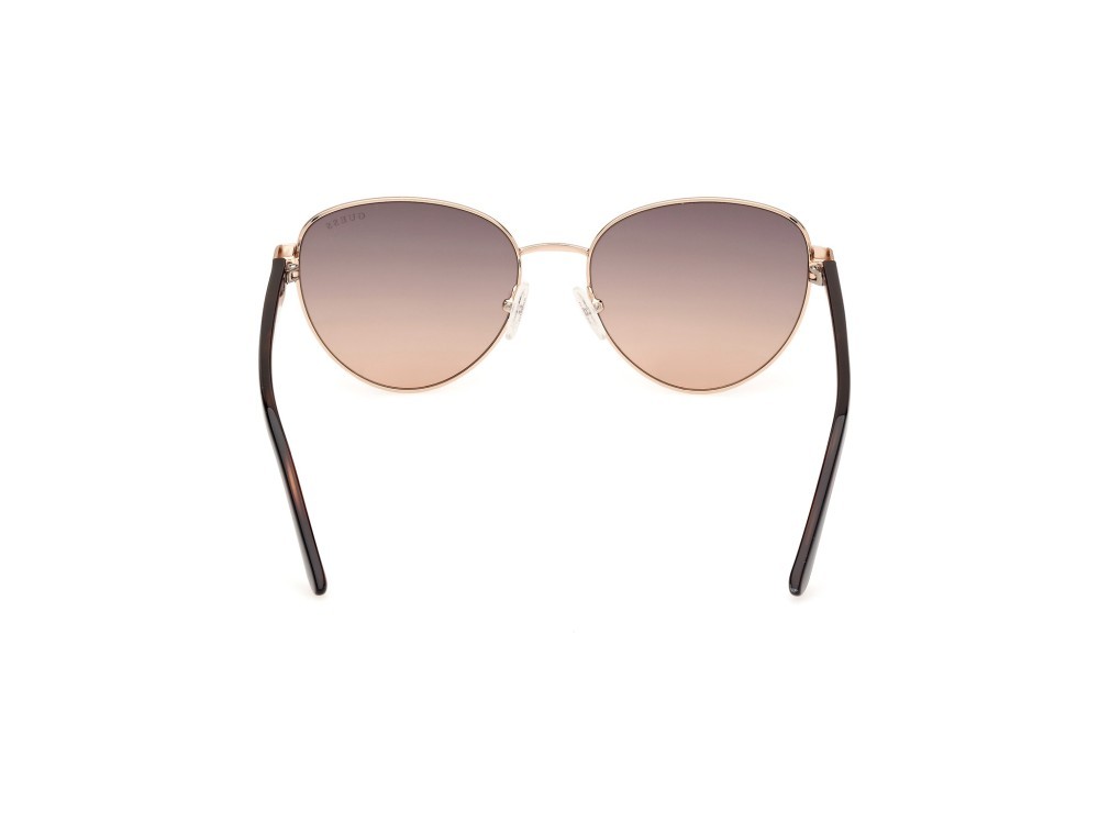 Occhiali da sole Guess GU00101 (32F) colore oro pallido lucido forma rotondo lenti marrone sfumato