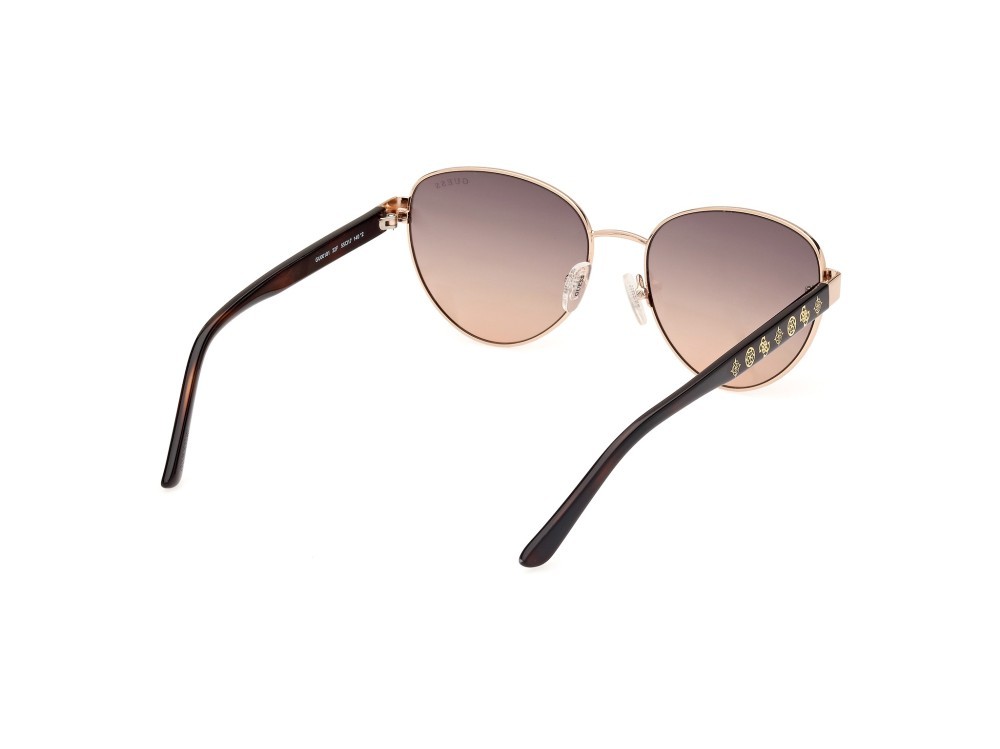 Occhiali da sole Guess GU00101 (32F) colore oro pallido lucido forma rotondo lenti marrone sfumato